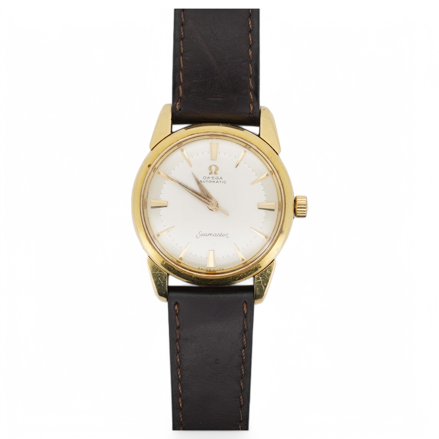 A gentleman's early 1960's 18ct gold Omega Seamaster automatic wrist watch, with baton numerals, movement c. 552, case diameter 34mm, on an associated leather strap. Condition - fair